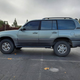 Illustration for article titled For $13,800, Could This Modded 2002 Lexus LX470 Get You Off-Roading?